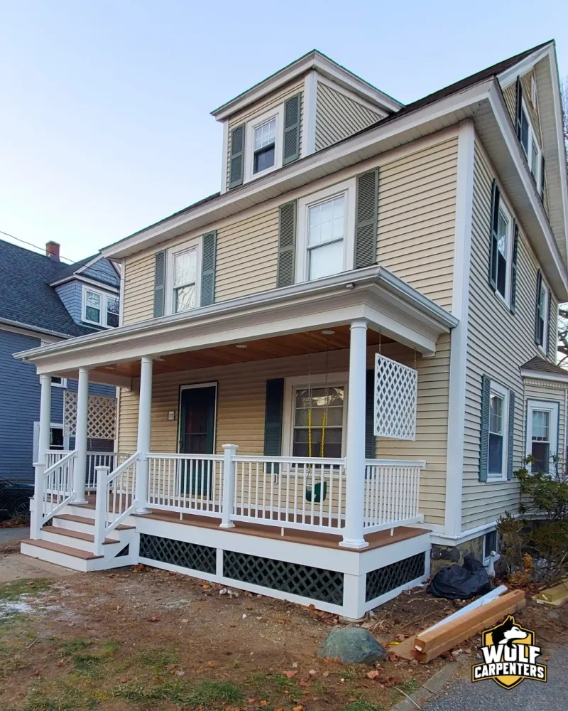 New porch with white columns and composite after